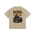 Beige t-shirt with a graphic of a car and 'Decibels' text on a white background