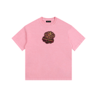 Pink t-shirt with a logo on a white background