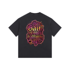 Black t-shirt with colorful text design on a white background
