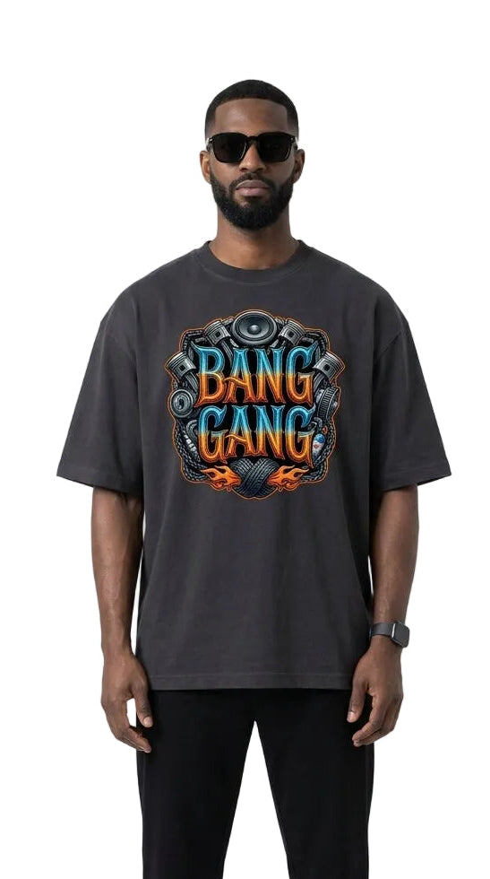 Man wearing a dark gray t-shirt with 'Bang Gang' graphic design on a white background