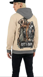 Person wearing a beige hoodie with a graphic design on the back, standing against a white background