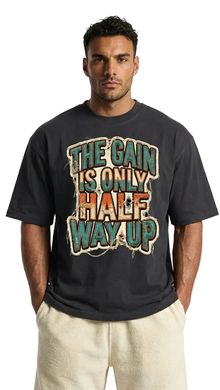 Man wearing a black t-shirt with colorful text design on a white background
