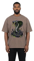 Man wearing a brown t-shirt with a snake graphic on a white background