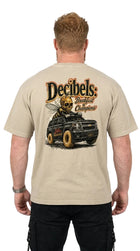 Man wearing a beige t-shirt with a graphic design on the back, featuring a truck and text.