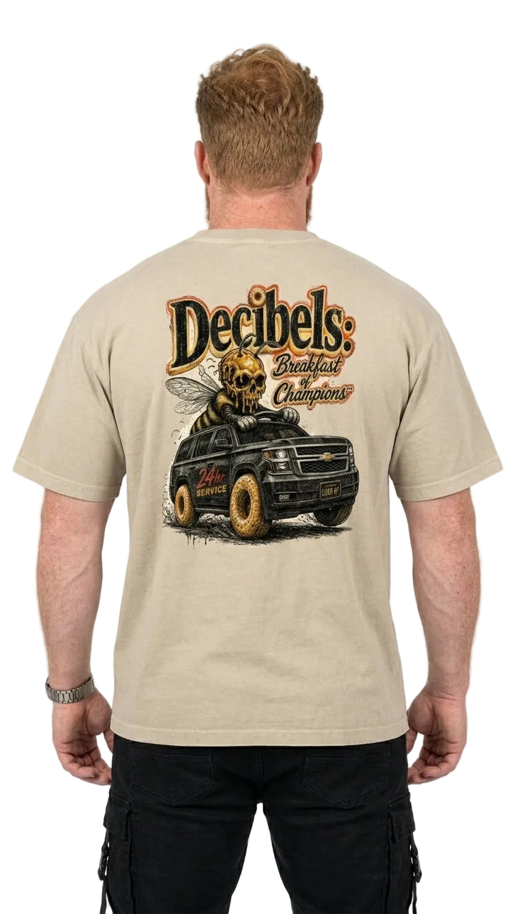 Man wearing a beige t-shirt with a graphic design on the back, featuring a truck and text.