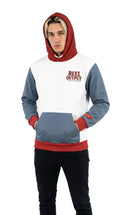 Person wearing a hoodie with 'Reel Output' branding on a white background