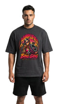 Man wearing a black t-shirt with a colorful graphic design on a white background