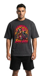 Man wearing a black t-shirt with a colorful graphic design on a white background