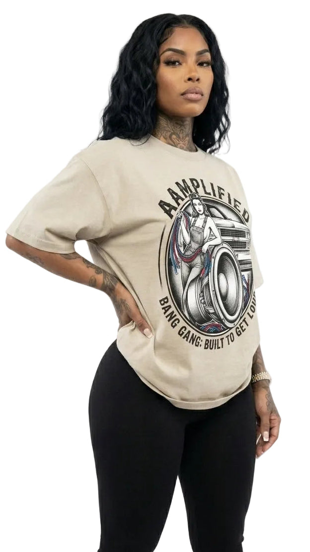 Woman wearing a beige t-shirt with graphic design on a white background