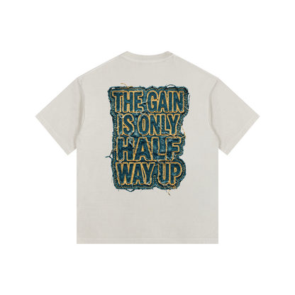 Beige t-shirt with text design on the back against a white background